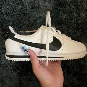 Black and white nike cortez.